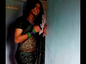 Indian of age crossdresser surrounding unfledged saree